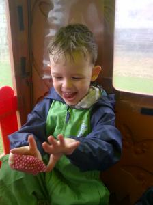 Eddison`s sheer delight as he looks at his bare hands, outside in the daytime! Thanks to our UV proofed Wendy House.